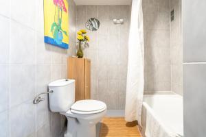 a bathroom with a toilet and a bath tub at Taiko in Port de Pollensa +15 photos