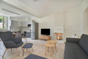 a living room with a couch and a table at Casa Sparto in Meganisi