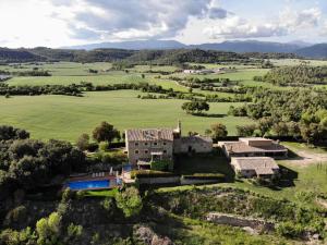 an aerial view of an old house in a field at El Porxet in Navés