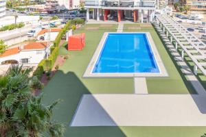 an overhead view of a swimming pool on a building at Calpe primera linea con piscina in Casas de Torrat