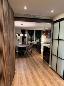 a dining room and living room with a dining table at Design Apartment in Vesterbro with Large Balcony in Copenhagen