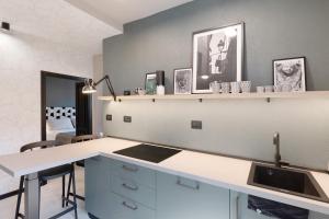 a kitchen with a sink and a counter top at Torri e tramonti in Albenga