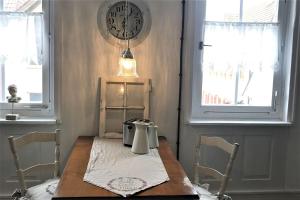 a table with a tea kettle on it in a room at Ferienwohnung Bei Der Kirch in Münsingen +15 photos