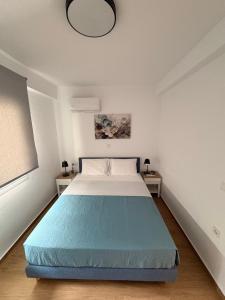 a bedroom with a large bed in a room at Green Almond D1 in Orfánion