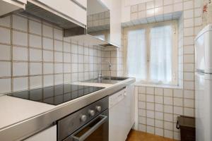 a small kitchen with a sink and a window at Beach Paradise - Cicerone in Levanto