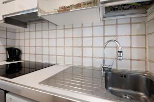 a kitchen sink with a faucet on top of it at Beach Paradise - Cicerone in Levanto +18 photos