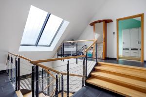 a staircase in a house with a window at Ferienwohnung Goelz in Bad Schussenried