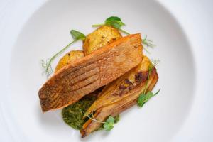 a plate of food with a sandwich on a plate at Passage House Hotel in Newton Abbot +36 photos
