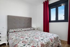 a bedroom with a bed and a window at Casa Manoli in Hozanejos +16 photos
