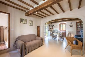 a living room with a couch and a table at Appartamento Gemma Verde-tavoleto in Castiglione dʼOrcia +34 photos