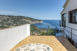 a balcony with a view of the ocean at Casa Con Vistas Aiguablava in Tamariu