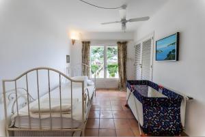 a bedroom with two beds and a window at La Chamade Cala Dor in Santanyi +37 photos