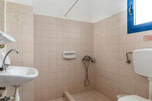 a bathroom with a toilet and a sink at Perasma Studios 8 in Kipri
