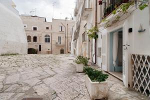 an alley in an old town with buildings at Il Pescatore in Monopoli