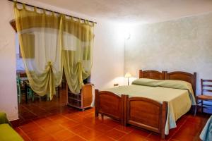a bedroom with a bed and a table in a room at Vecchio Molino in Gavorrano