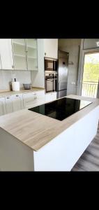 a kitchen with a white counter top in a room at Casa con mucha luz natural in Bisbal del Penedès