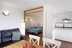 a living room with a couch and a table at Casa Garten in Tijarafe +22 photos