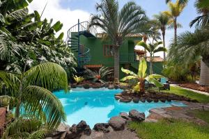 a house with a swimming pool in front of a house at Casa Garten in Tijarafe