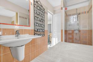 a bathroom with a sink and a shower at Cap à Gap T2 Bas De Villa in Gap +21 photos