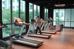 a man walking on a treadmill in a gym at Cozy Studio Netflix Parking Self Checkin Wifi free wifi 138 in Cyberjaya