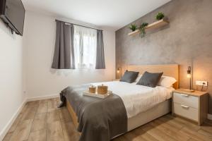 a bedroom with a large bed and a window at Les Roques in Castellnou de Bages +27 photos