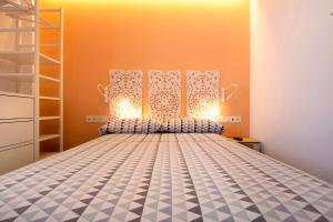 a bedroom with a bed with a blue and white at Falco 3 in Corralejo +16 photos