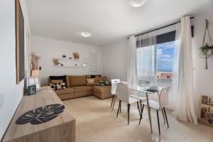 a living room with a table and a couch at Apartamento Erma Candelaria in Candelaria