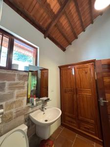 a bathroom with a sink and a toilet at Wildland Resort in Phú Quốc +87 photos