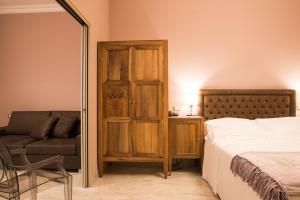 Postel nebo postele na pokoji v ubytování Palazzo Dei Mercanti - Dimora & Spa