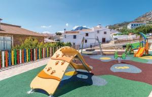 a playground with a slide in a park at Villa Godoy in Periana
