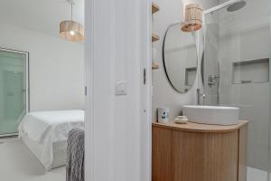 a bathroom with a sink and a mirror at Casa Dina - by And Service in Golfo Aranci