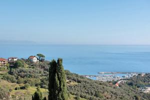 a house on top of a hill overlooking the ocean at Casa Marincanto in Varazze
