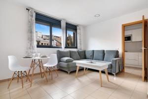 a living room with a couch and a table at El Refugio in Sardina