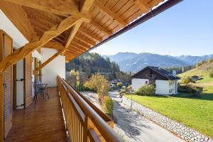 a balcony with a view of the mountains at Hatzlhof Appartements in Vipiteno