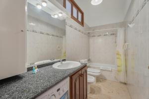 a bathroom with a sink and a toilet at Bonita Casa Annie in Abades +21 photos