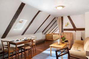 a living room with a table and a couch at Altes Polchower Pfarrhaus in Alt Polchow