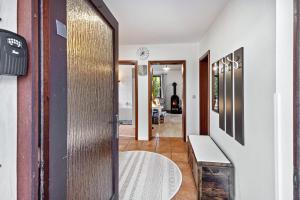 a hallway with a door leading into a room at Gästehaus Oehm in Faßberg +26 photos