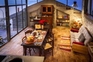 a living room with a table with food on it at Appartamento Panoramico Como in Blevio