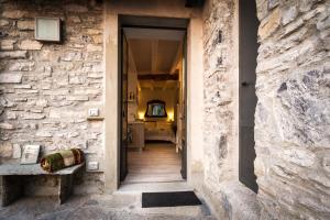 a hallway of a house with a stone wall at Appartamento Panoramico Como in Blevio