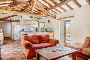 a living room with a couch and a table at Gîtes Bourdeverre in Sanxay