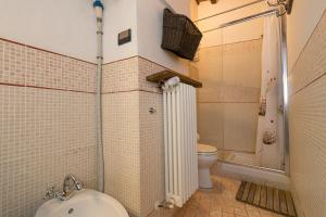 a bathroom with a toilet and a shower and a sink at Il Mirtillo in Pisa +17 photos