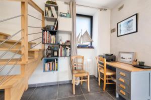 a room with a desk and a book shelf at Ker Helo-ana in Brignogan-Plage