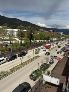 a busy city street with cars parked on the road at Ozan Konaklama in Hatay +1 photo