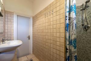 a bathroom with a sink and a shower at Pergola 706 in Stintino +12 photos