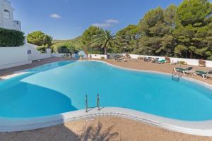 a large swimming pool with blue water at Casa Golf in Son Parc