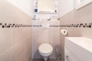 a bathroom with a toilet and a sink at Villa de Maithe, clim, terrasse in Sernhac +19 photos