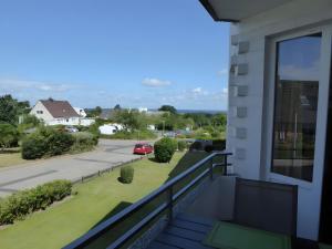a balcony with a view of a street at Ferienwohnung Seepferdchen in Heiligenhafen