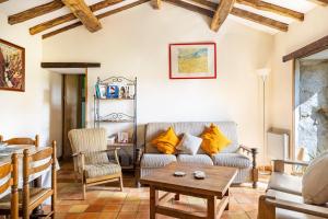 a living room with a couch and a table at Gîtes Bourdeverre in Sanxay