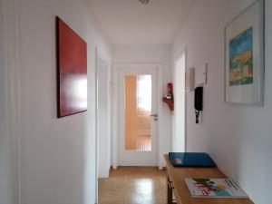 a living room with a table and a door at Ferienwohnung Kirsch-Kern in Mössingen