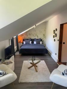 a bedroom with a king sized bed and a table at Gutsherren Räume in Groß Upahl